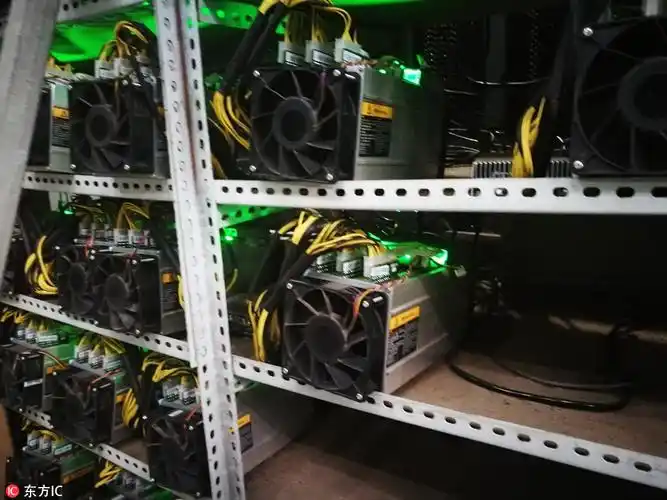 A miner inspecting the cooling system of a mining rig.